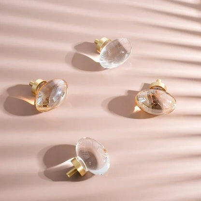 The Mantara C-0008 is a modern artificial crystal + brass knob in champange/brass, ideal for wardrobes and drawers.