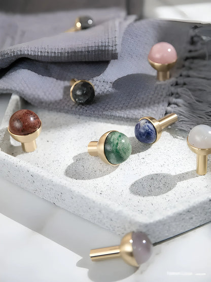 The Mantara C-0006 is a modern crystal + brass knob in blue, ideal for drawers and cabinets.