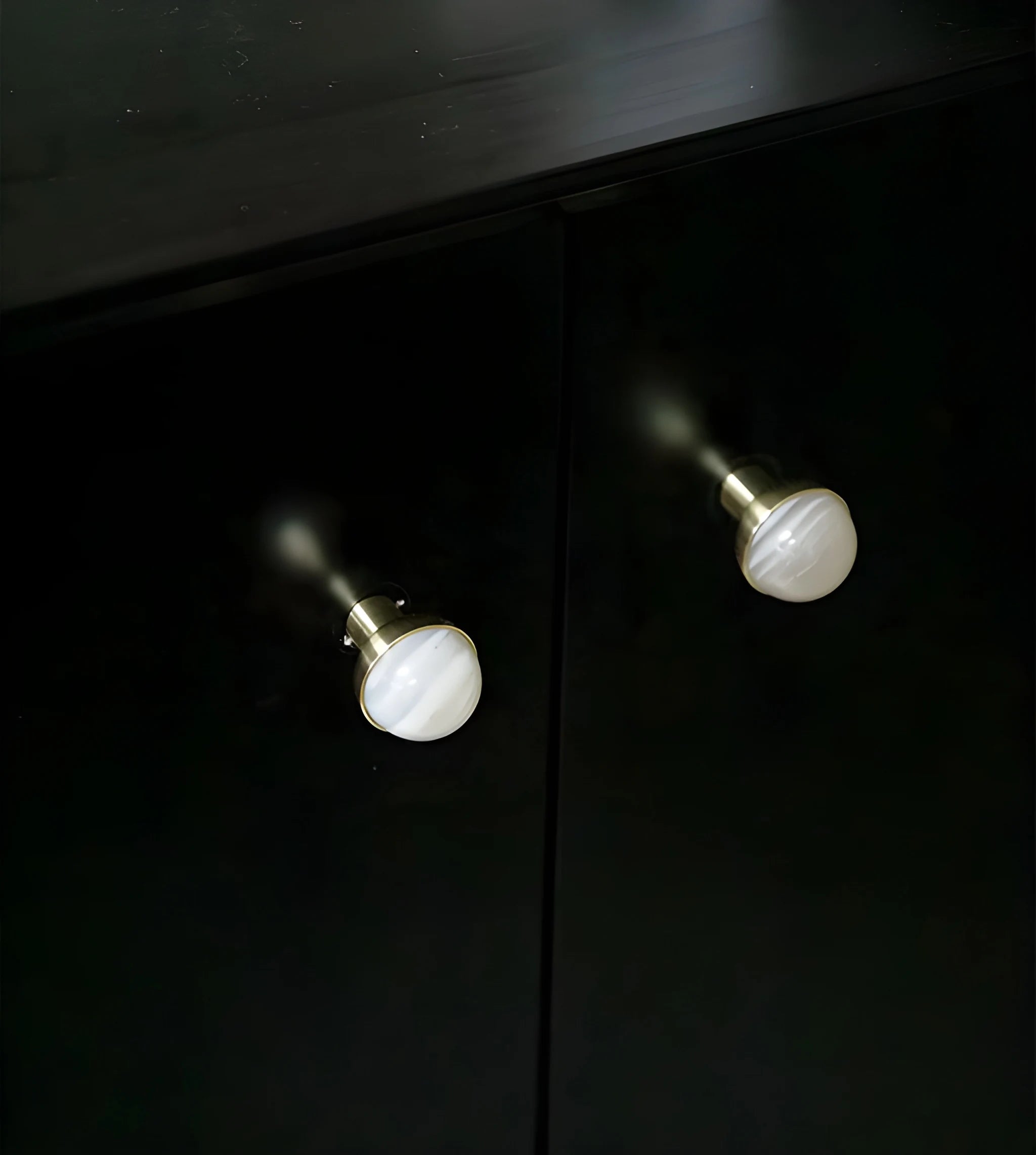 The Mantara C-0006 is a modern crystal + brass knob in white, ideal for drawers and cabinets.