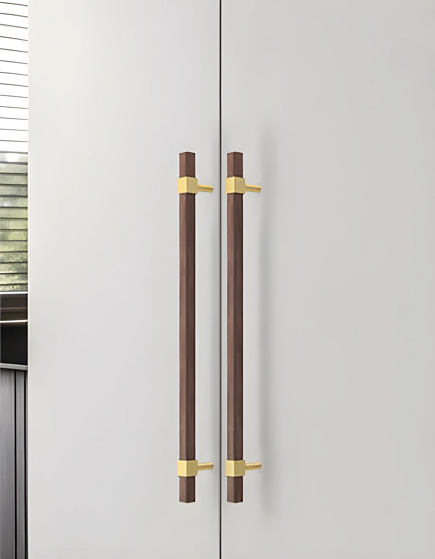Mantara Ebonex Handle W-0009 is a modern brass &amp; walnut handle in brown with brushed finish, ideal for doors &amp; furniture.