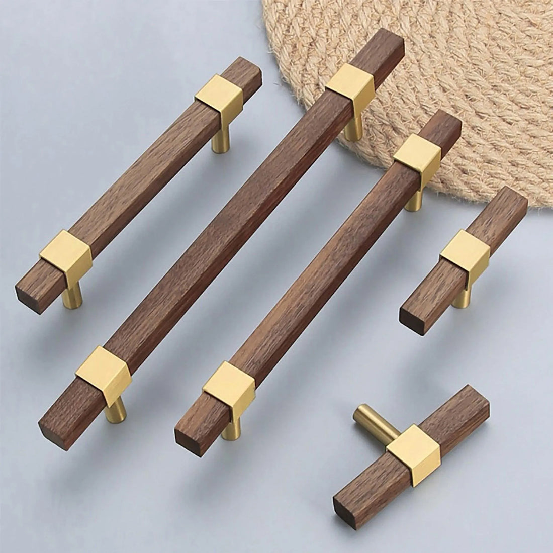 Ebonex Handle W-0009 in brushed brass &amp; walnut, sizes 70–391mm, suits doors, cabinets &amp; wardrobes—by Mantara.