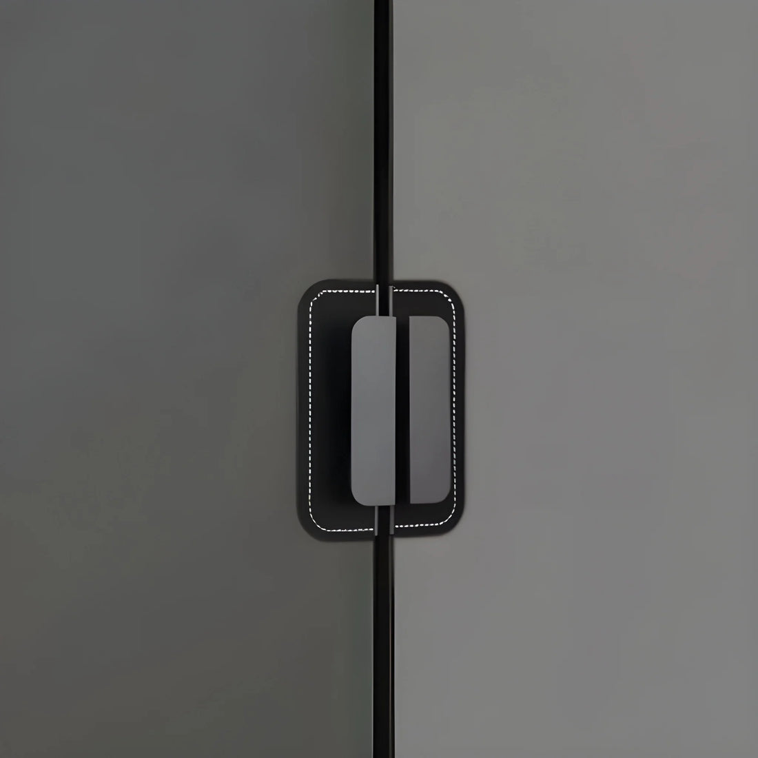 The Mantara L-0007 Geometry Leather Handle is a modern grey and black handle in matte finish, ideal for doors, cabinets, and wardrobes.