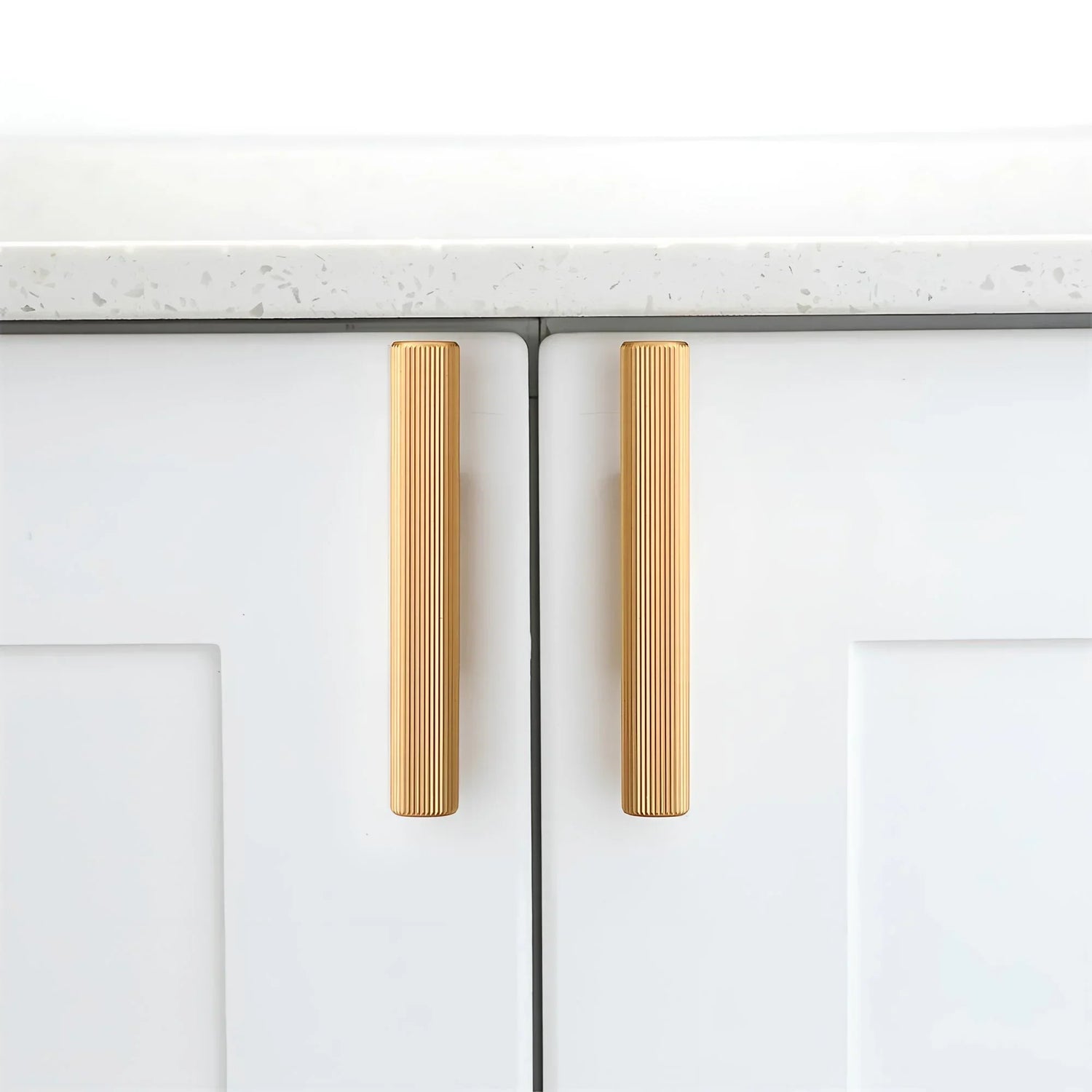 The Mantara AL-0012 Mara Handle is a modern aluminum handle in gold with a brushed finish, ideal for kitchens and drawers.