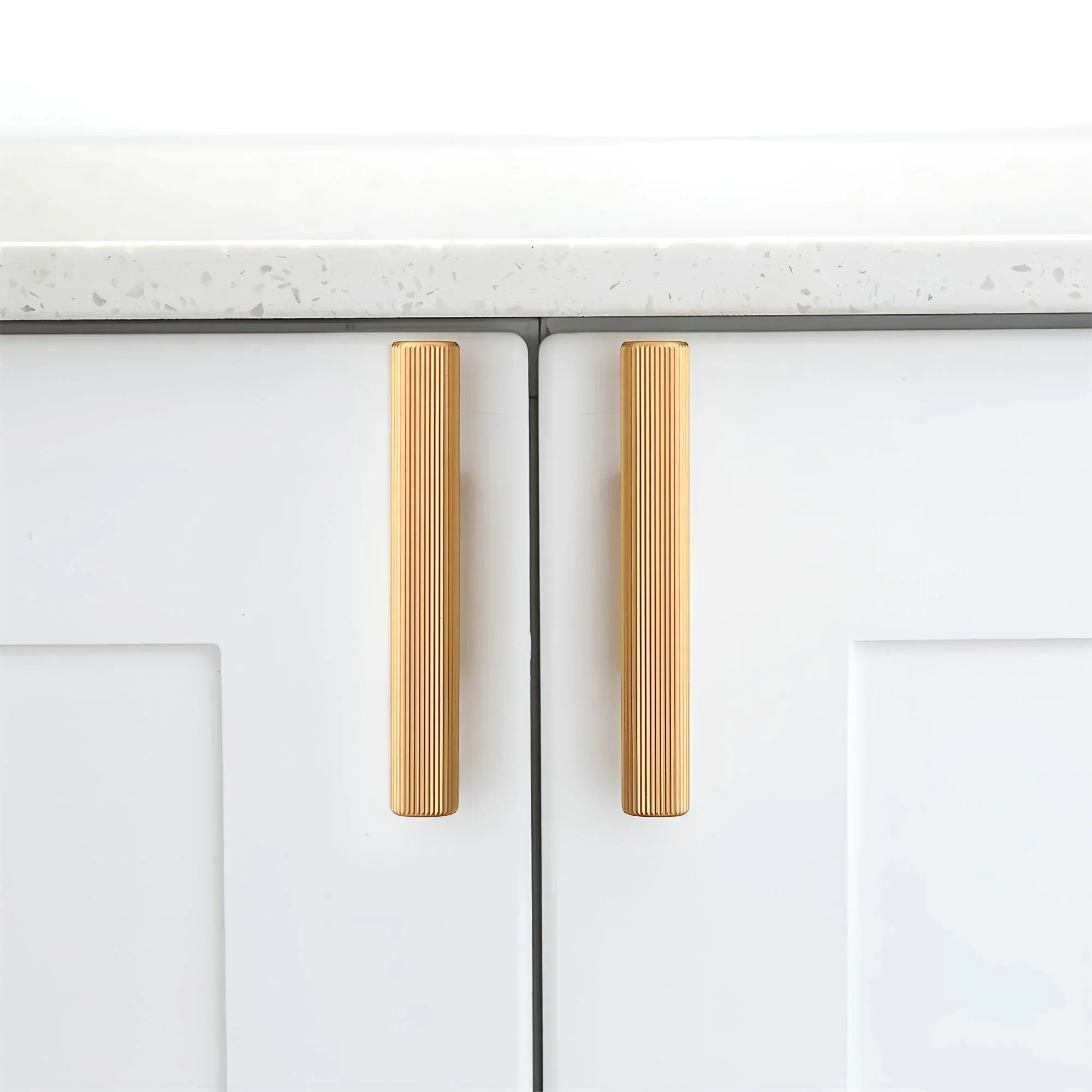 The Mantara AL-0012 Mara Handle is a modern aluminum handle in gold with a brushed finish, ideal for kitchens and drawers.