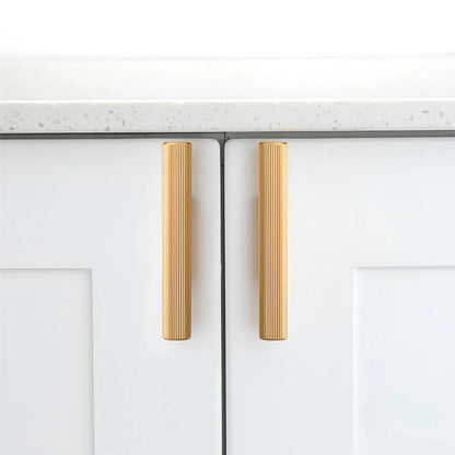 The Mantara AL-0012 Mara Handle is a modern aluminum handle in gold with a brushed finish, ideal for kitchens and drawers.