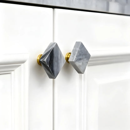 The Mantara M-0007 Diamonds Knob is a modern marble and brass square knob in grey and brass, ideal for kitchens and furniture.