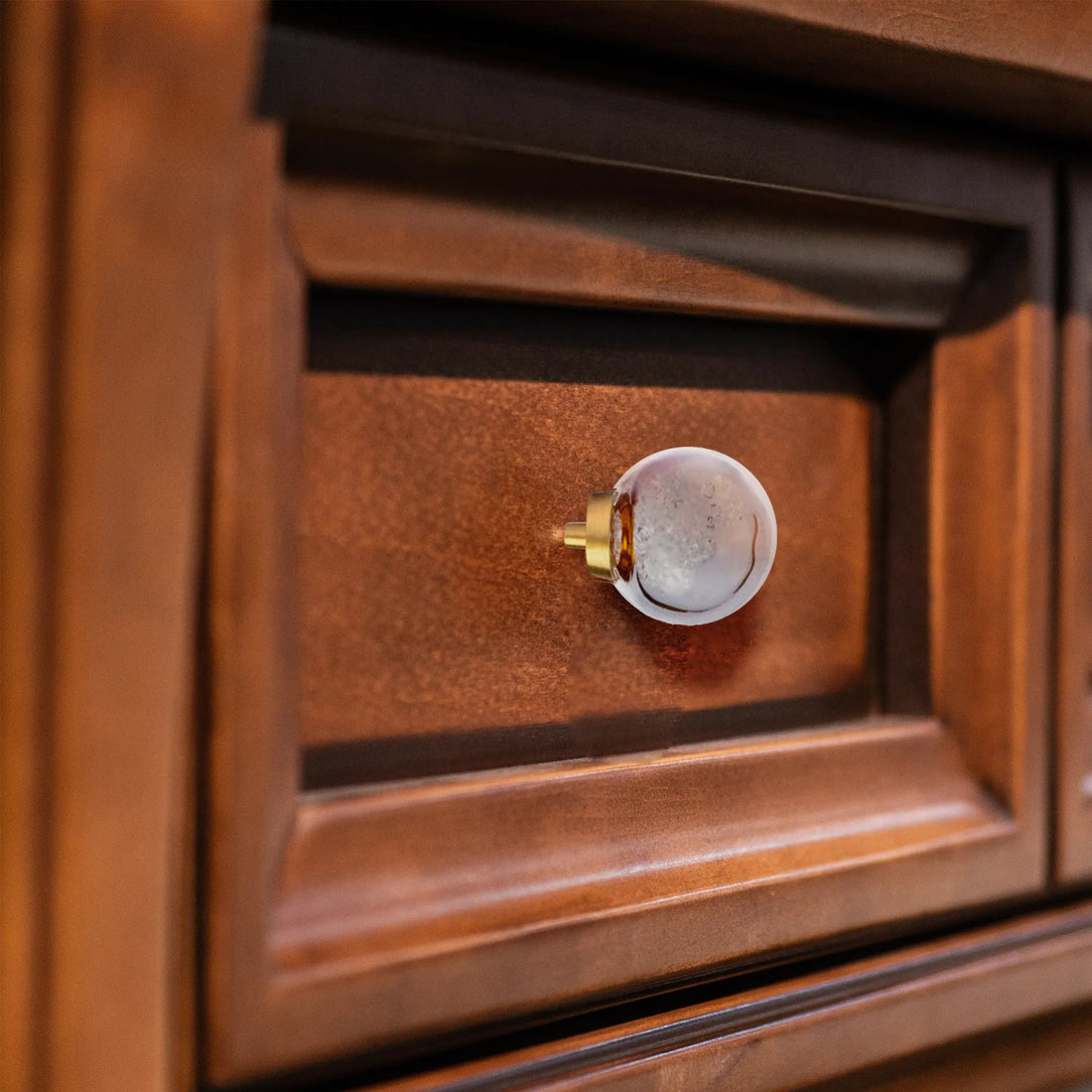 The Mantara C-0024 Frost Knob is a modern crystal and brass knob in white, ideal for drawers, cabinets, and kitchens.
