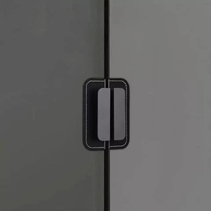 The Mantara L-0007 Geometry Leather Handle is a modern grey and black handle in matte finish, ideal for doors, cabinets, and wardrobes.