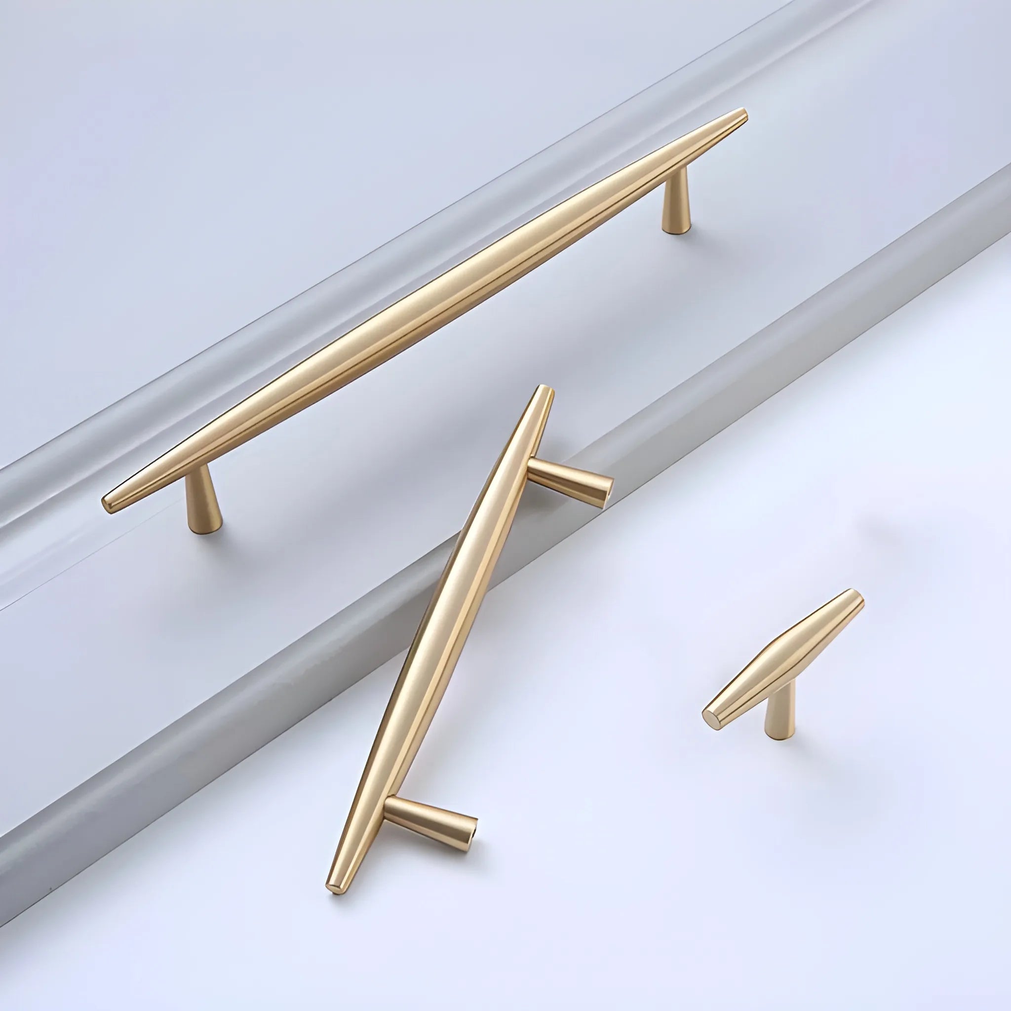 Mantara Gilded T Bar Handle B-0072 is a modern brass handle in brushed gold, ideal for wardrobes, doors, and kitchens.