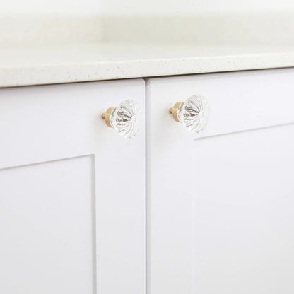 The Mantara C-0010 is a modern crystal knob in white/brass, ideal for kitchens, drawers, and cabinets.