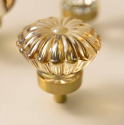 The Mantara C-0010 is a modern crystal knob in champagne/brass, ideal for kitchens, drawers, and cabinets.