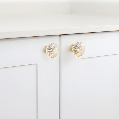 The Mantara C-0010 is a modern crystal knob in champagne/brass, ideal for kitchens, drawers, and cabinets.