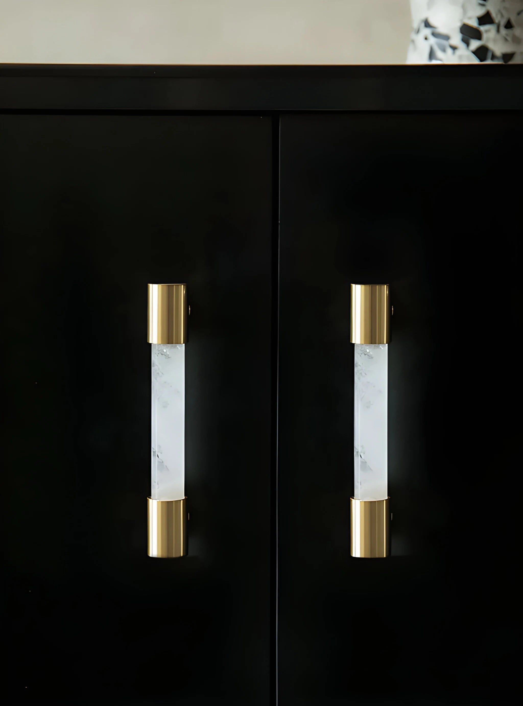 The Mantara C-0014-96 Haze Handle is a modern crystal and brass handle in white, ideal for cabinets and wardrobes.