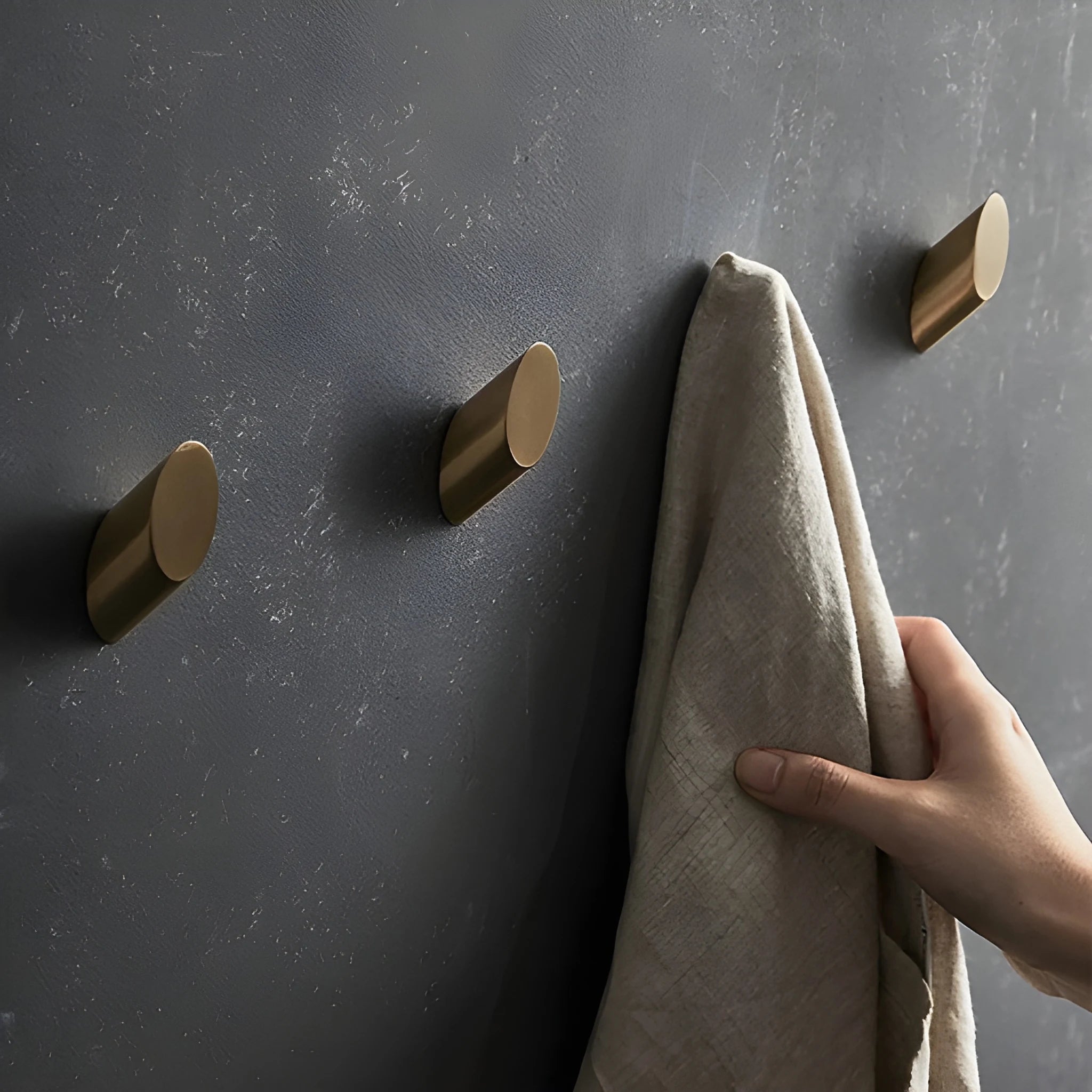 Mantara Hexa Hook B-0091 is a modern brushed brass wall hook in gold, perfect for bathrooms, bedrooms, and living areas.