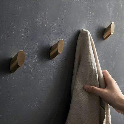 Mantara Hexa Hook B-0091 is a modern brushed brass wall hook in gold, perfect for bathrooms, bedrooms, and living areas.