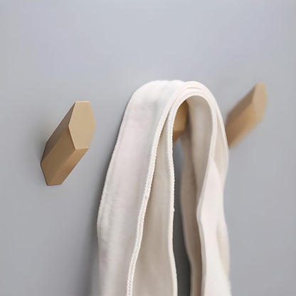Mantara Hexa Hook B-0091 is a modern brushed brass wall hook in gold, perfect for bathrooms, bedrooms, and living areas.