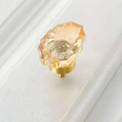 The Mantara C-0009 is a modern artificial crystal + brass knob in champange/brass, ideal for kitchens and cabinets.