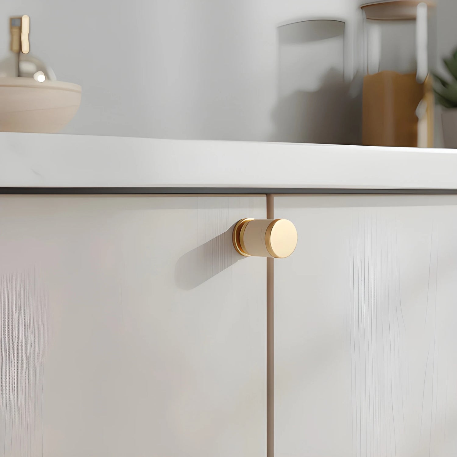 The Mantara L-0003 Tanner Knob is a modern brass and leather knob in white, perfect for cabinets and furniture.