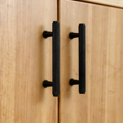 The Mantara AL-0013 Inez Handle is a modern black aluminum handle with a brushed finish, perfect for kitchens, drawers, and cabinets.