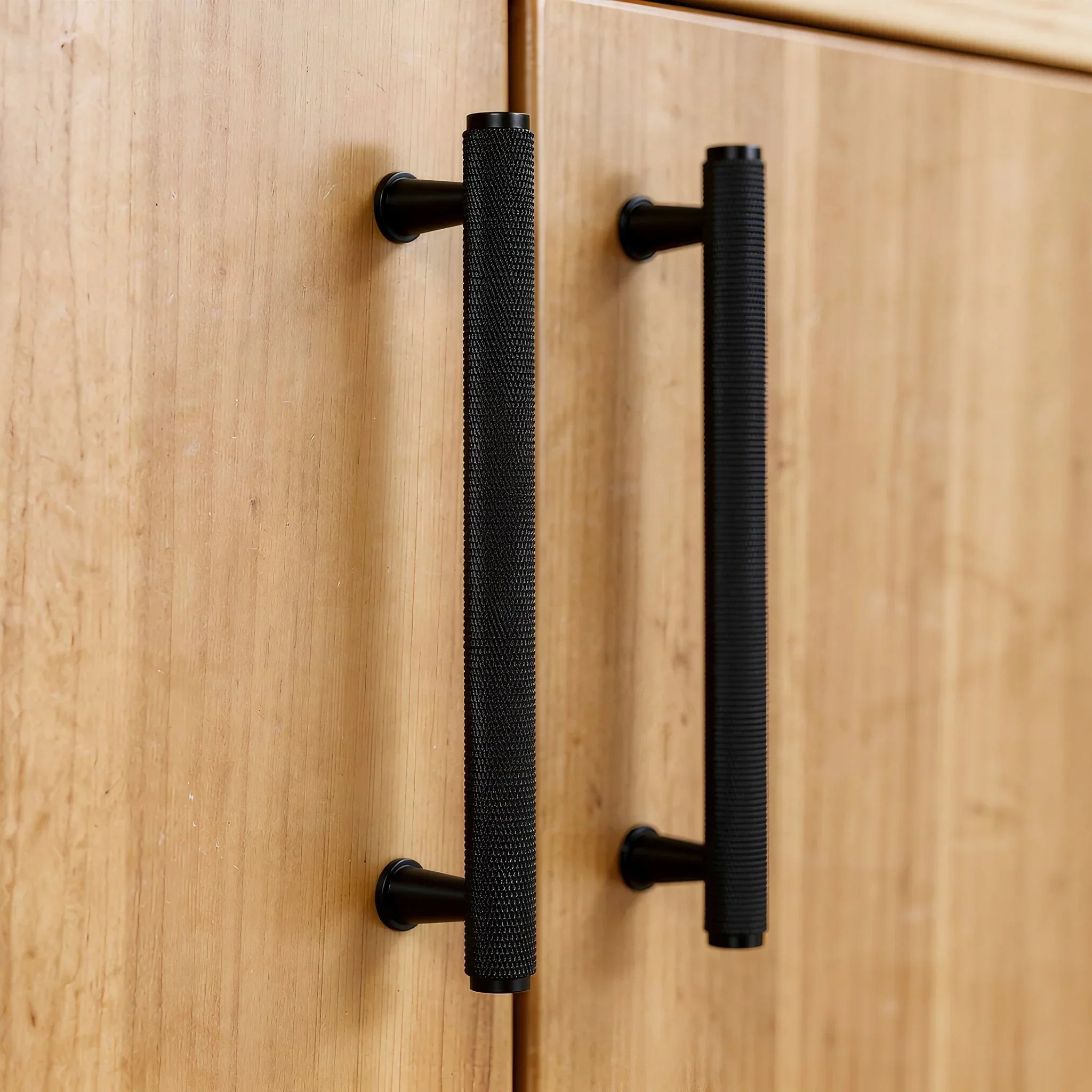 The Mantara AL-0013 Inez Handle is a modern black aluminum handle with a brushed finish, perfect for kitchens, drawers, and cabinets.