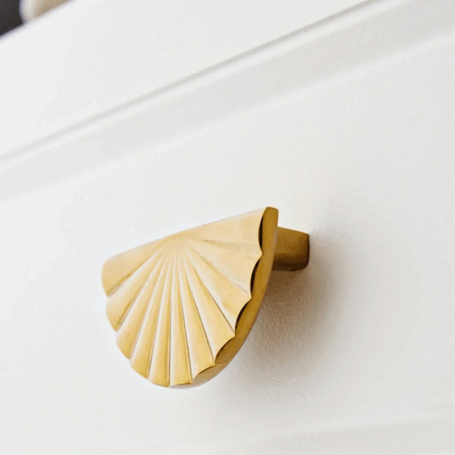 The Mantara B-0029 Kanti Knob is a modern brass handle in gold brushed finish, perfect for doors, drawers, and cabinets.