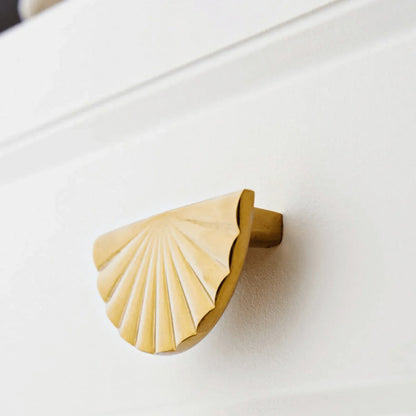 The Mantara B-0029 Kanti Knob is a modern brass handle in gold brushed finish, perfect for doors, drawers, and cabinets.