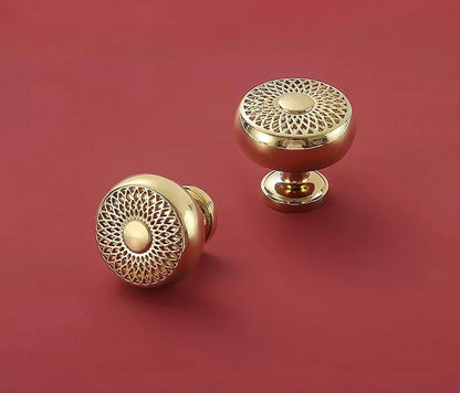 The Mantara B-0032 Karna Knob is a modern polished brass knob in gold, ideal for main doors, kitchens, drawers, and wardrobes.