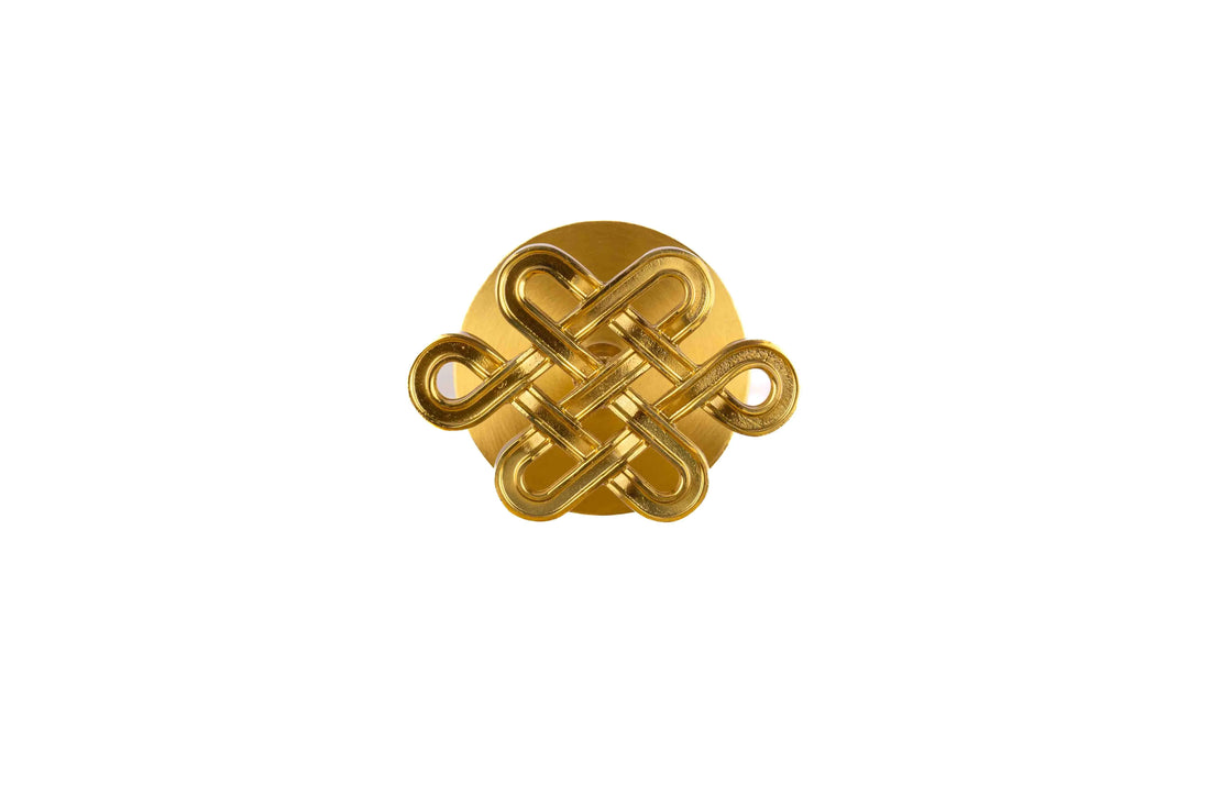 The Lattice Hook by Mantara B-0116 is a modern brass wall hook in gold with a brushed finish, ideal for kitchens and bedrooms.