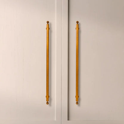 The Mantara B-0122 Aureate Handle is a modern brass handle in bronze with a brushed finish, ideal for kitchens and dressers.