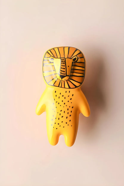 The Mantara CR-0001-Lion Knob is a modern yellow ceramic knob with a polished finish, ideal for wardrobes, cabinets, and kids&