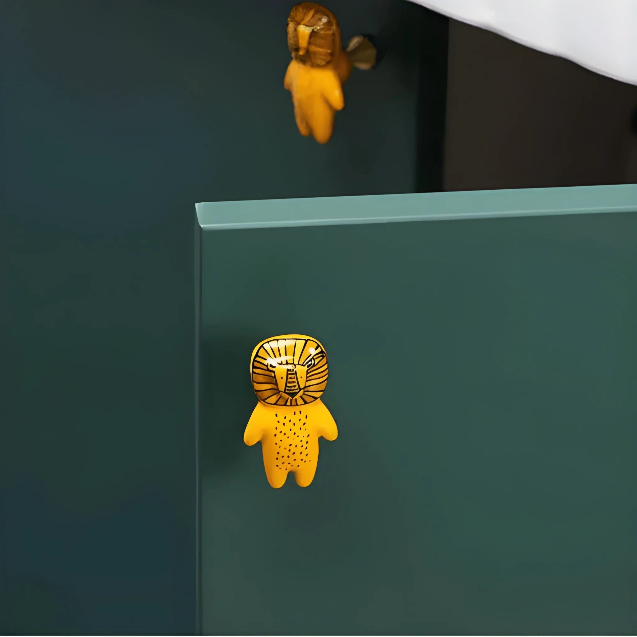 The Mantara CR-0001-Lion Knob is a modern yellow ceramic knob with a polished finish, ideal for wardrobes, cabinets, and kids&