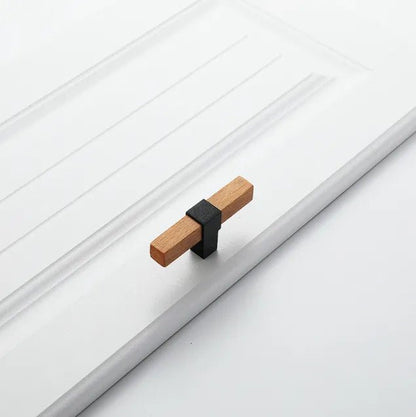 Mantara Lorien Handle W-0028 is a modern zinc and beech wood Tbar in black ideal for kitchen and dresser drawers.