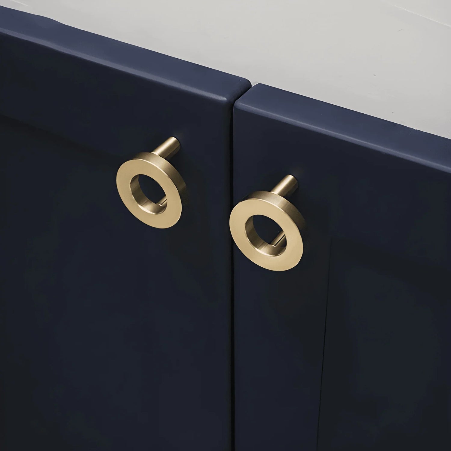 The Mantara B-0025 Lupa Knob is a modern brushed brass knob in gold, ideal for doors, kitchens, furniture, and cabinets.
