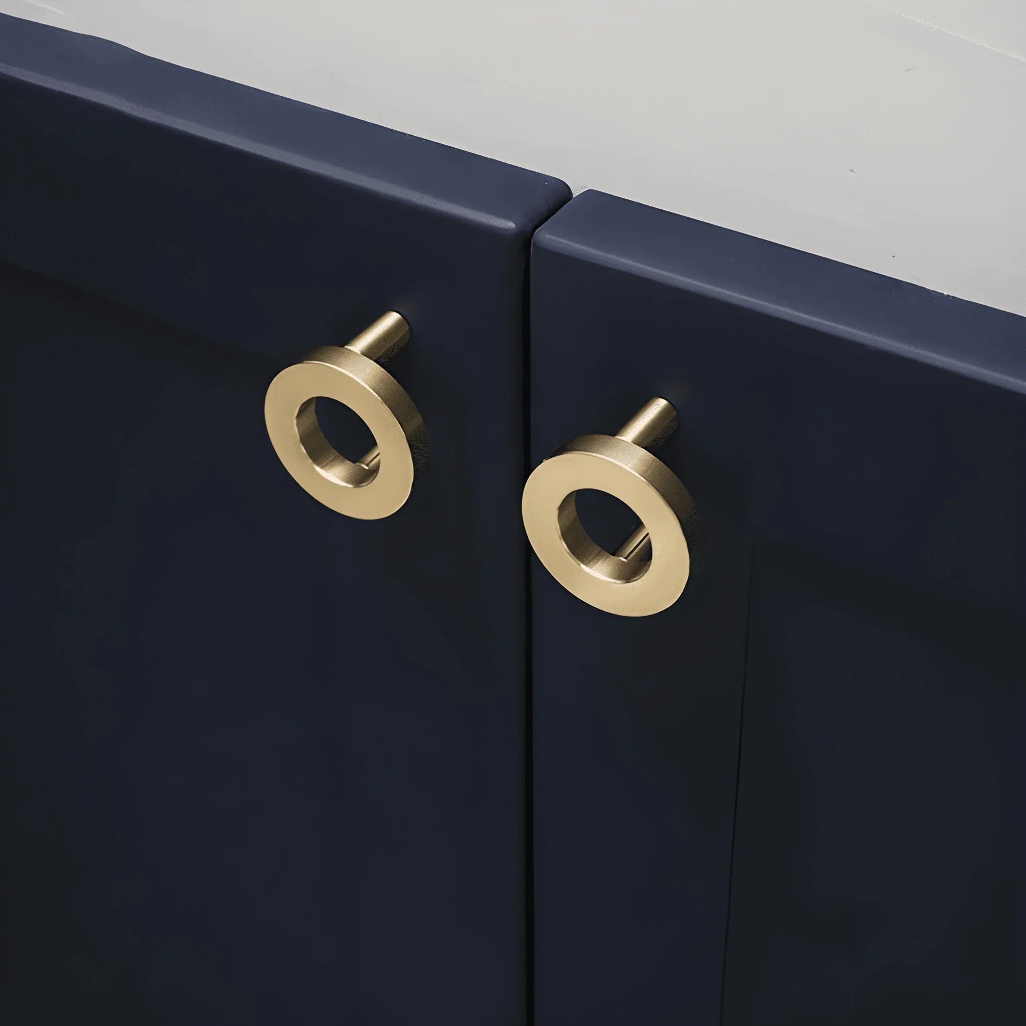 The Mantara B-0025 Lupa Knob is a modern brushed brass knob in gold, ideal for doors, kitchens, furniture, and cabinets.