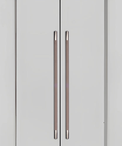 Gray cabinet doors with sleek metallic handles, blending seamlessly into a gray background, styled by Mantara.