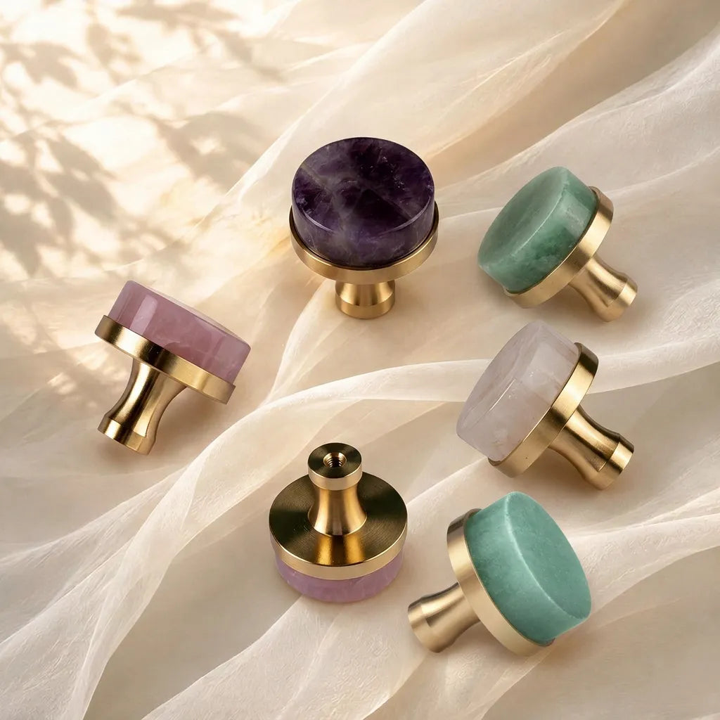 Pink, Green, Purple, white Round Knobs placed on the cream white cloth screen and sunlight leaves shadow background