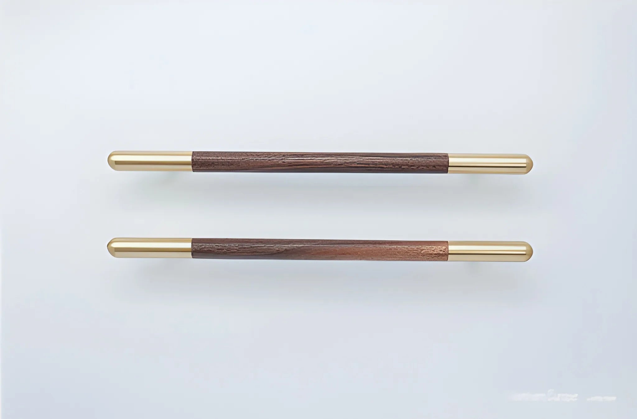 Mantara Mahogany Handle W-0003-H is a natural wood handle in brown with brushed brass finish, ideal for doors &amp; furniture.