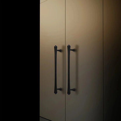 Mantara Raphael Handle B-0068 is a modern brushed brass handle in black, ideal for kitchens, drawers, and wardrobes.