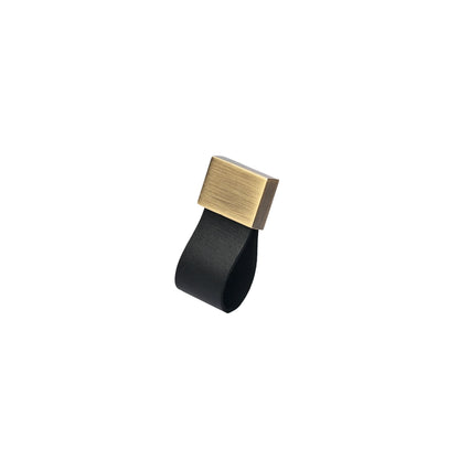 The Mantara L-0015 is a modern crystal handle in black, ideal for kitchen drawers and dressers.