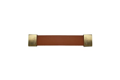 The Mantara L-0015 is a modern crystal handle in brown, ideal for kitchen drawers and dressers.