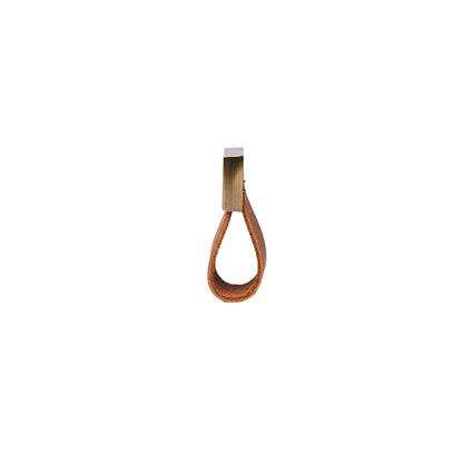 The Mantara L-0015 is a modern crystal handle in brown, ideal for kitchen drawers and dressers.