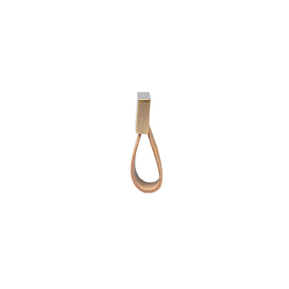 The Mantara L-0015 is a modern crystal handle in beige, ideal for kitchen drawers and dressers.