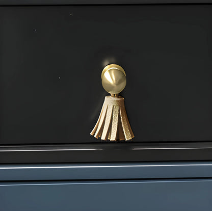 The Mantara L-0002 Maverick Drop Knob is a modern leather and brass knob in white, ideal for kitchens and furniture.