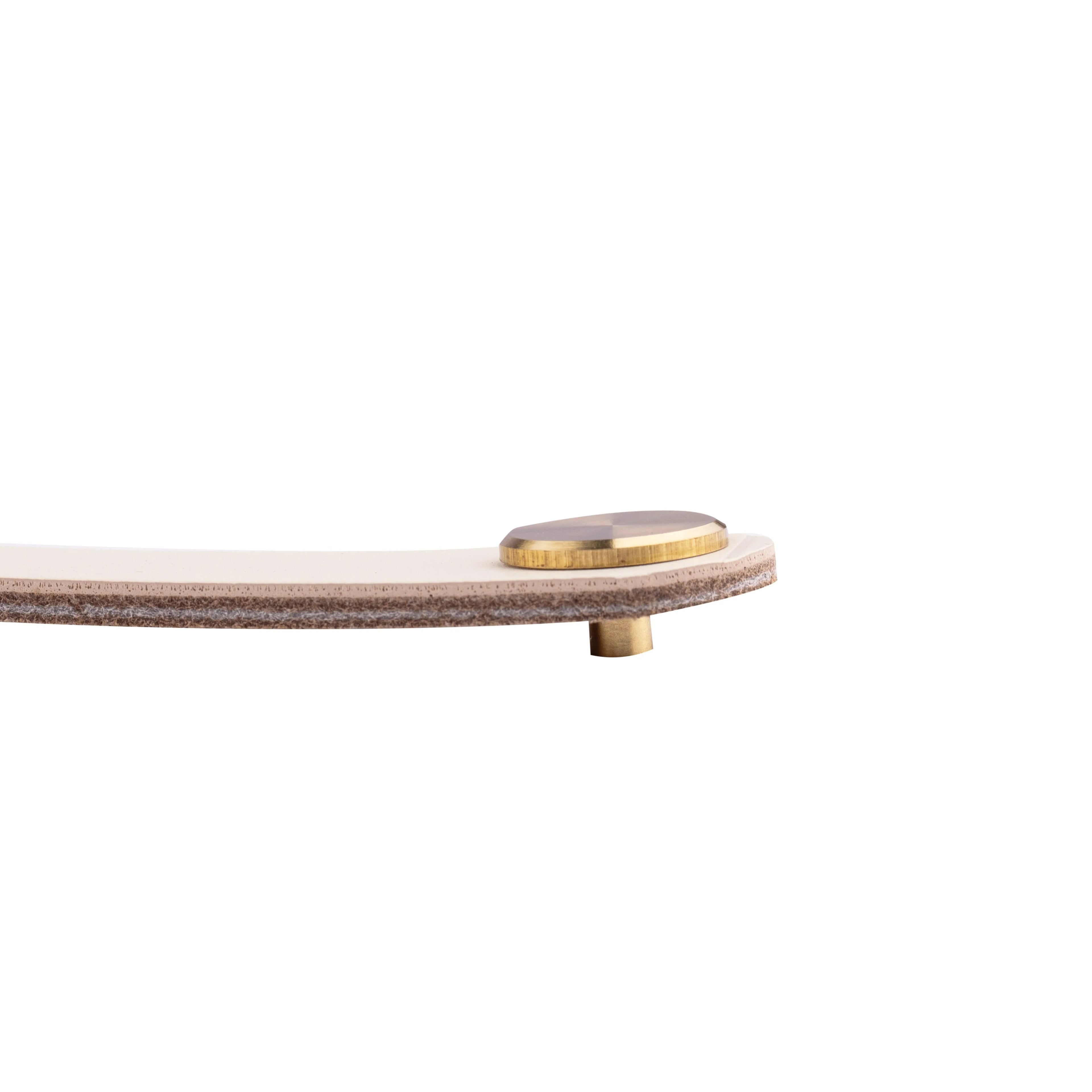 The Mantara L-0001-160 Maverick Handle is a Nordic leather and brass handle in white, ideal for kitchens and wardrobes.