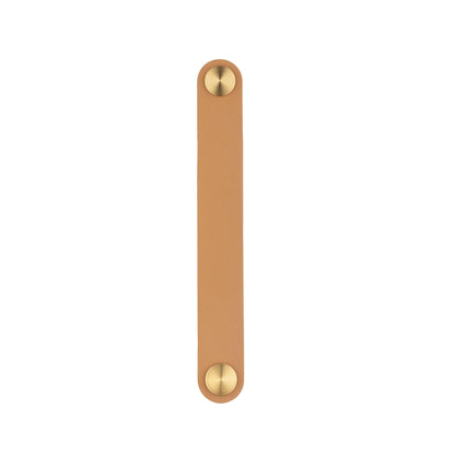 The Mantara L-0001-160 Maverick Handle is a Nordic leather and brass handle in white, ideal for kitchens and wardrobes.