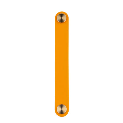 The Mantara L-0001-160 Maverick Handle is a Nordic leather and brass handle in orange, ideal for kitchens and wardrobes.