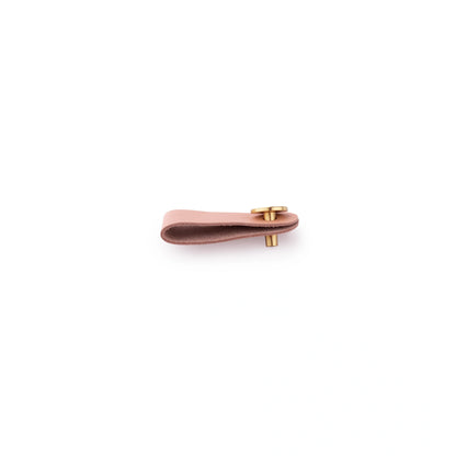 The Mantara L-0001 Maverick Pull Knob is a Nordic leather and brass knob in beige, ideal for kitchens and furniture.