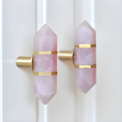 The Mantara C-0013 Mystic Handle is a modern crystal and brass knob in pink, ideal for drawers and cabinets.