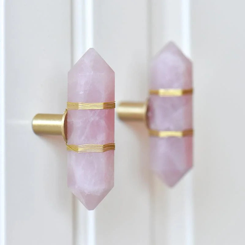 The Mantara C-0013 Mystic Handle is a modern crystal and brass knob in pink, ideal for drawers and cabinets.