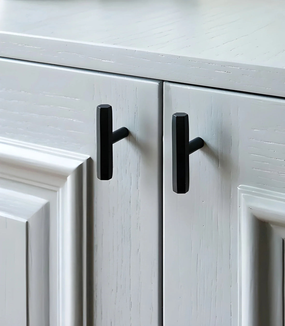 The Mantara B-0052 Oblivion T-Bar Handle is a modern solid brass handle in matte black, gold, and bronze, ideal for cabinets, kitchens, bedrooms, and drawers.